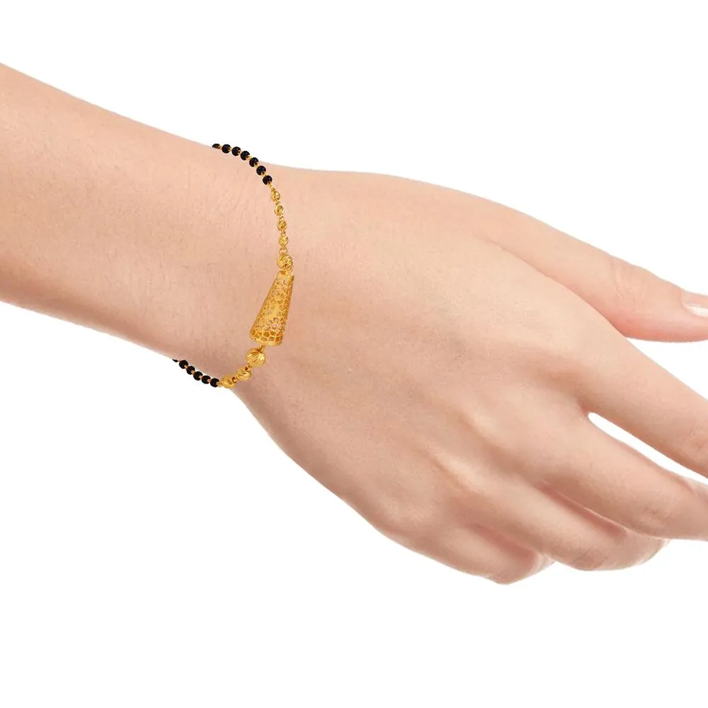 22k Gold Bracelet With Beads And Tapering Cylindrical-shaped Motif Having Geometric Patterns