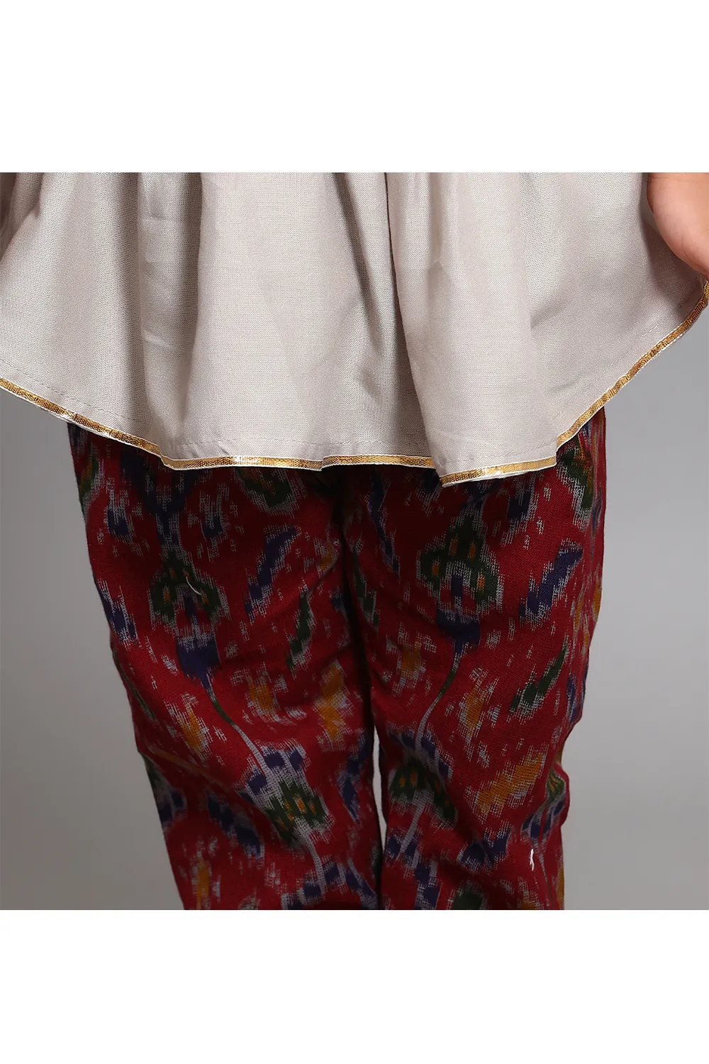 Grey peplum style kurta with red printed pants